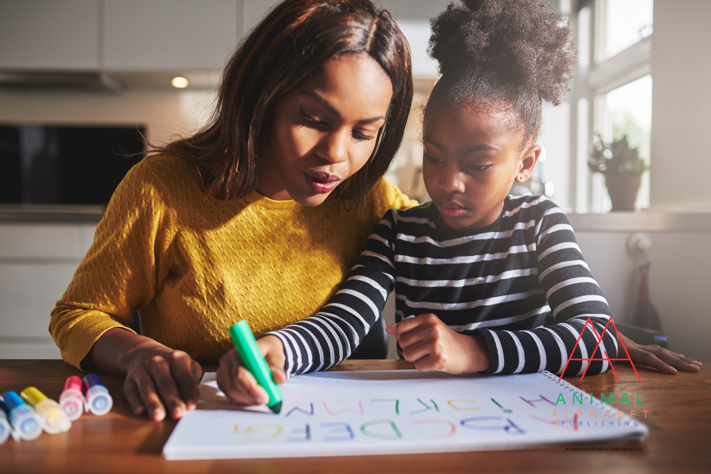 Parent and child coloring the Animal Alphabet Coloring Book